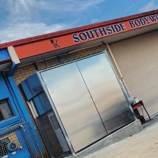 Stainless steel cladding and doors on a commercial building